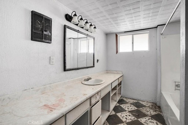 bathroom with vanity and shower / washtub combination