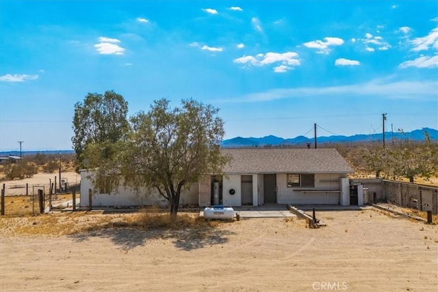 view of front of home with a mountain view