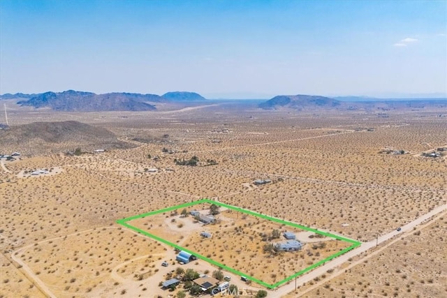 drone / aerial view featuring a mountain view