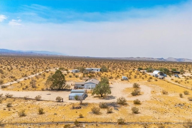 drone / aerial view with a mountain view and a rural view