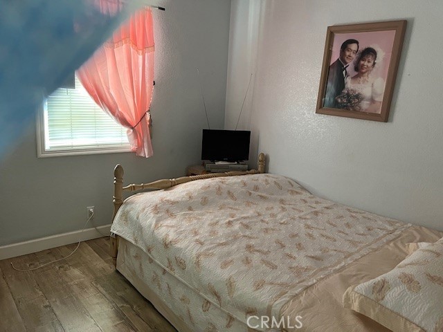 bedroom featuring hardwood / wood-style floors