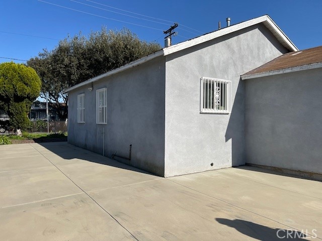 view of side of home with a patio