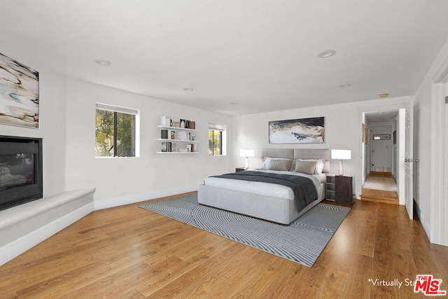 bedroom with hardwood / wood-style flooring