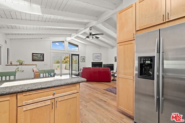 kitchen featuring light brown cabinetry, ceiling fan, light hardwood / wood-style flooring, vaulted ceiling with beams, and stainless steel fridge with ice dispenser