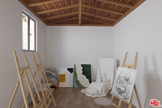 miscellaneous room with wood-type flooring, lofted ceiling with beams, and wooden ceiling