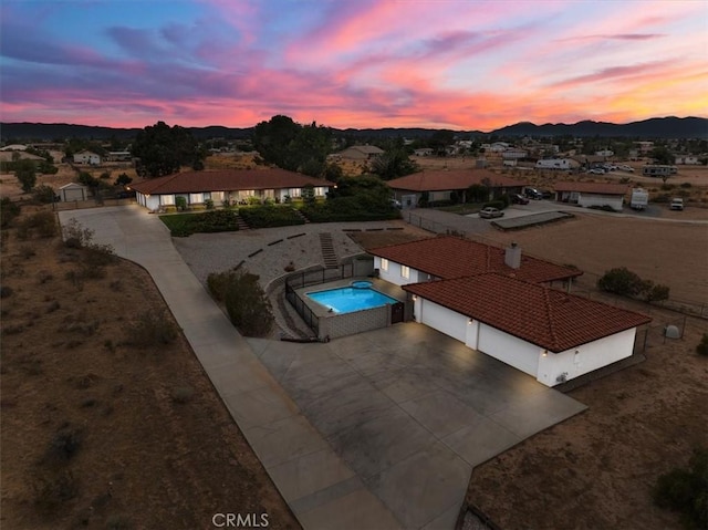 aerial view at dusk with a mountain view