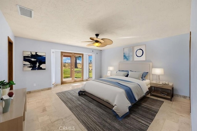 bedroom featuring a textured ceiling, access to outside, and ceiling fan