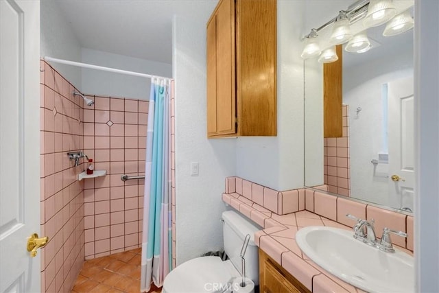 bathroom featuring vanity, toilet, and walk in shower