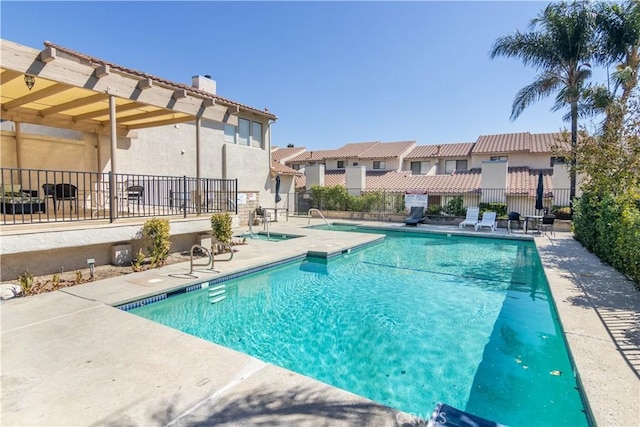 view of pool featuring a patio area