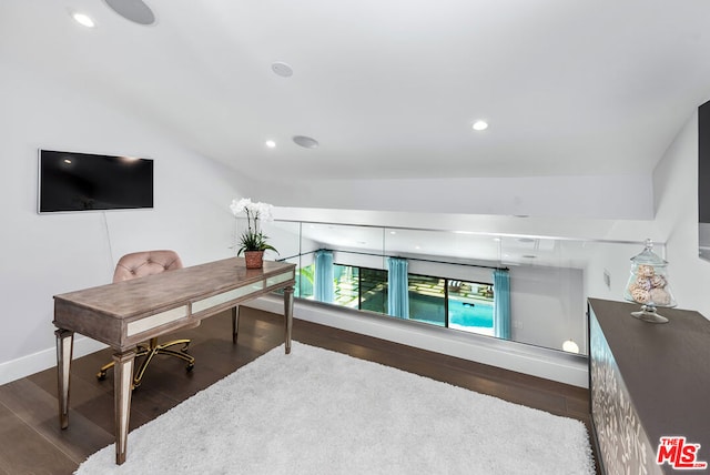 office featuring vaulted ceiling and dark hardwood / wood-style flooring