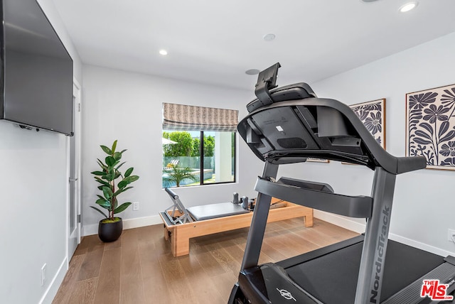 workout room with hardwood / wood-style floors