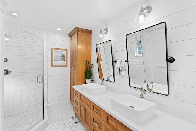 bathroom featuring tile patterned floors, vanity, walk in shower, and wooden walls