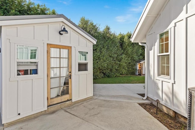 view of outbuilding with a lawn