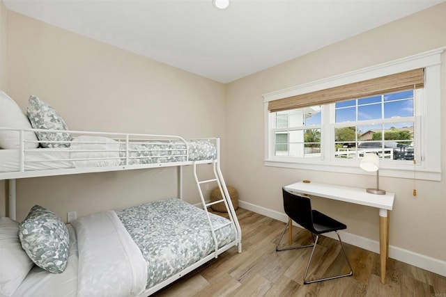 bedroom with wood-type flooring