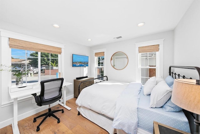 bedroom with light hardwood / wood-style floors