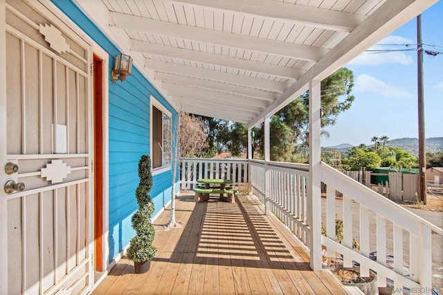 wooden deck featuring a mountain view