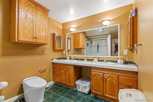 bathroom with vanity, toilet, an enclosed shower, and tile patterned flooring