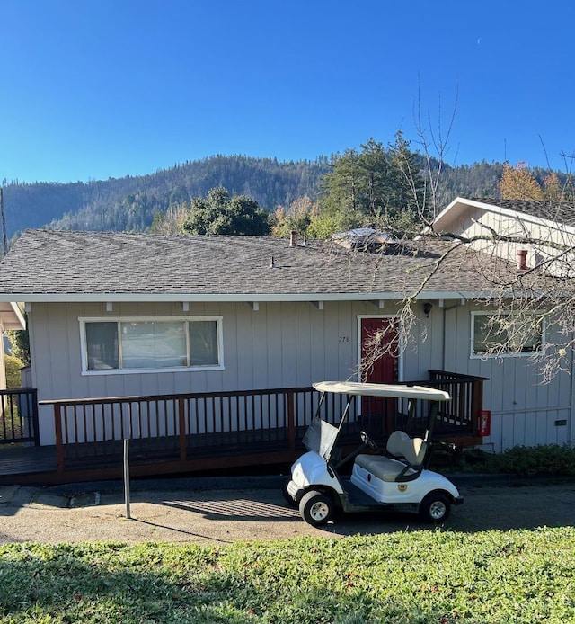 view of front of home with a wooden deck