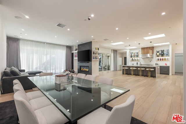 dining space with light wood-type flooring