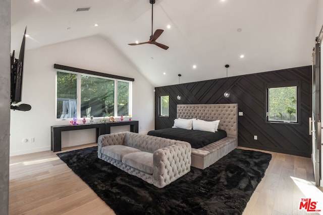 bedroom featuring high vaulted ceiling, light wood-type flooring, and ceiling fan