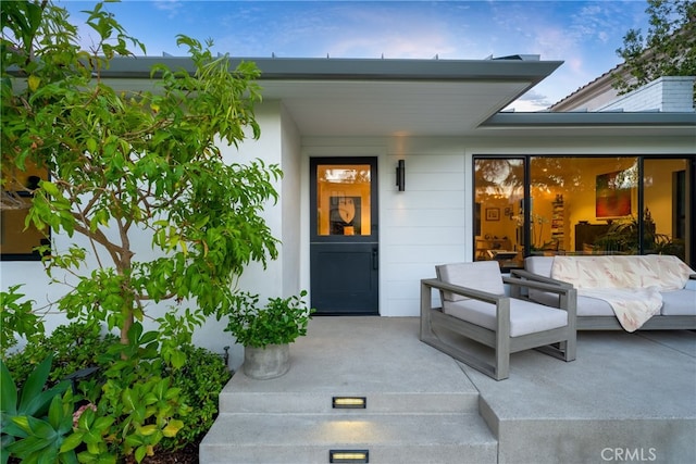 property entrance with a patio area