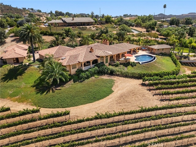 birds eye view of property with a rural view