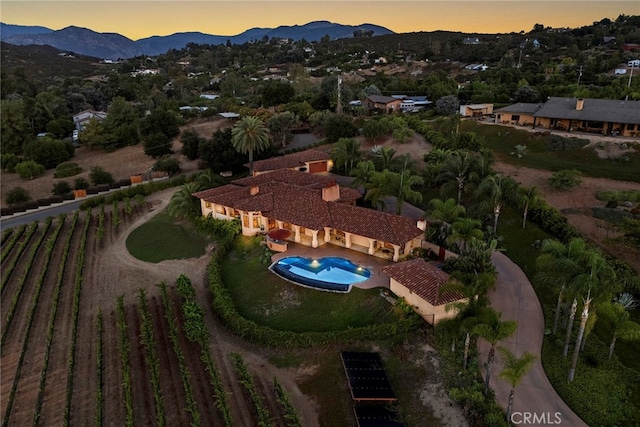 aerial view at dusk with a mountain view