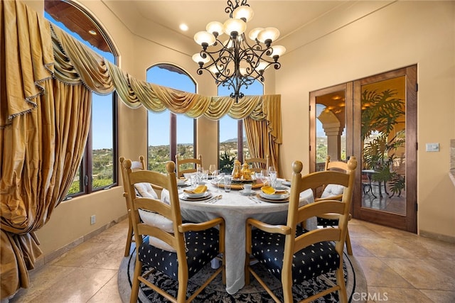 dining area with an inviting chandelier