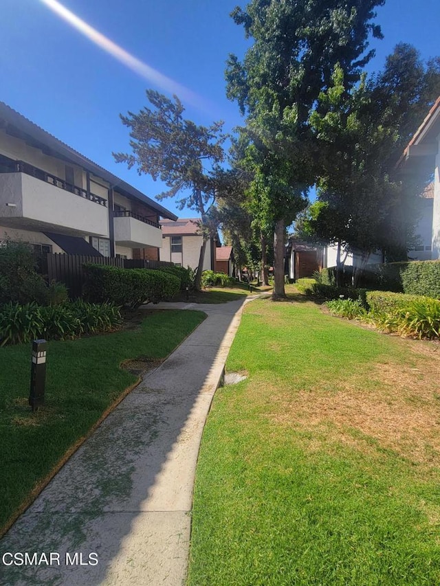 surrounding community featuring a lawn