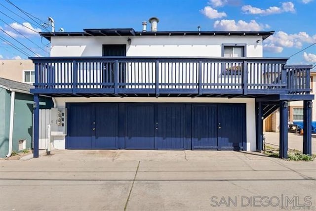 exterior space with a deck and a garage