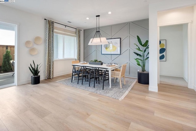 dining space featuring light hardwood / wood-style floors