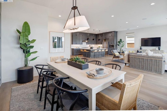 dining room with light wood-type flooring