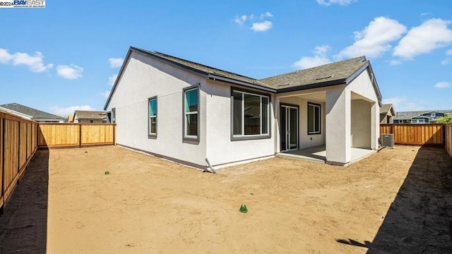 back of house with a patio area