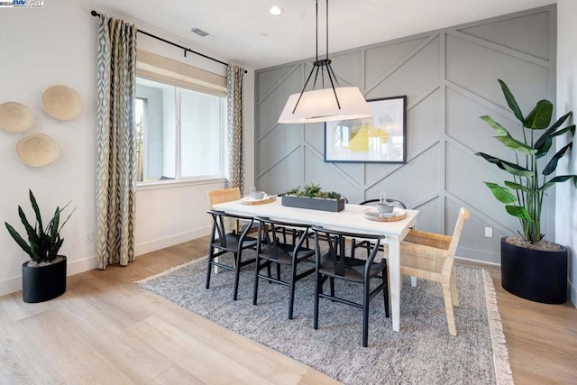 dining area with light hardwood / wood-style floors