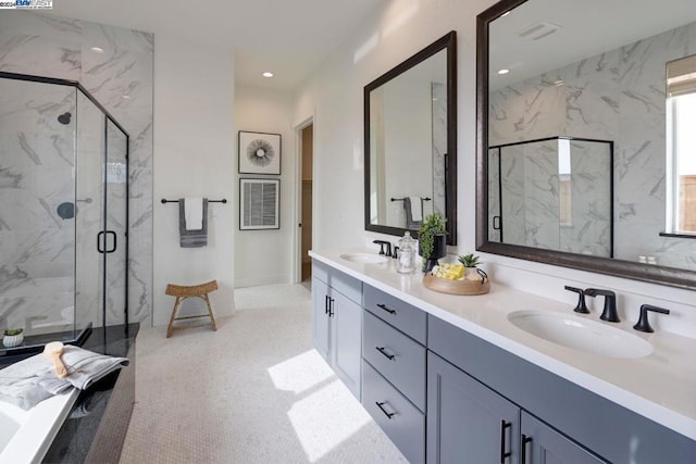 bathroom with vanity and an enclosed shower