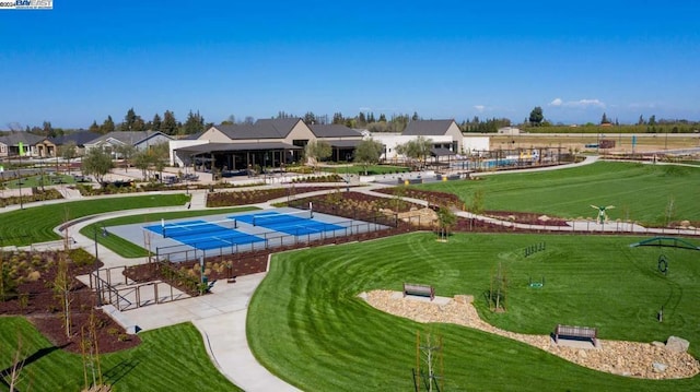 view of pool with tennis court