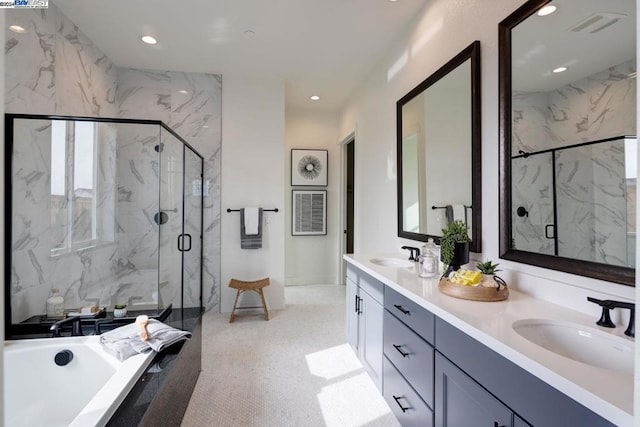 bathroom with vanity and separate shower and tub