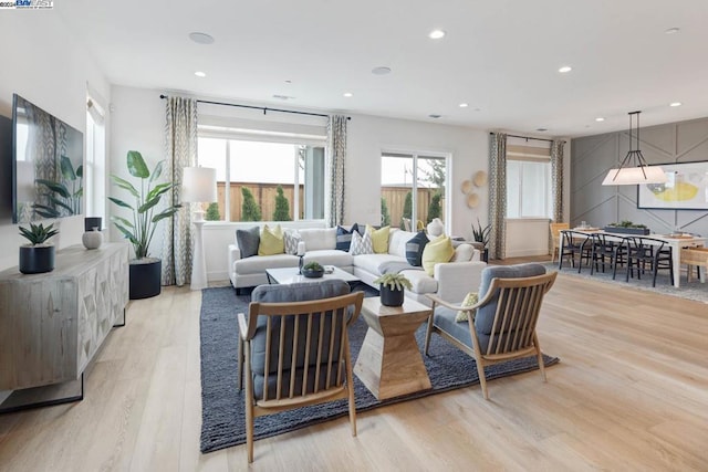 living room with light hardwood / wood-style flooring