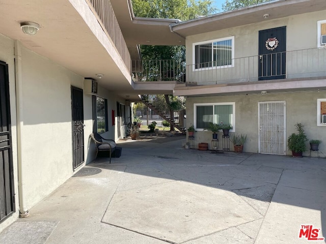 doorway to property with a patio area