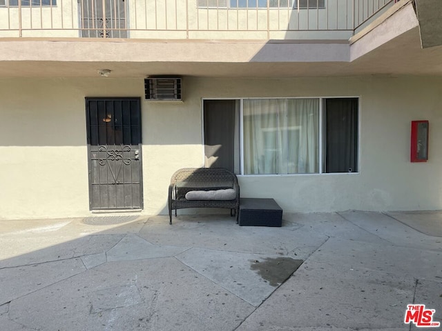 entrance to property with a patio area