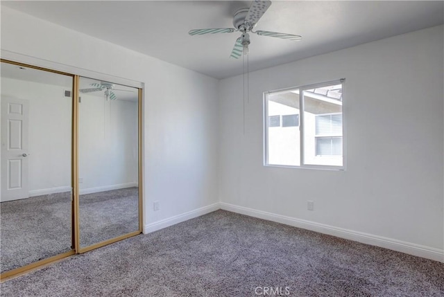 unfurnished bedroom featuring carpet flooring, ceiling fan, and a closet