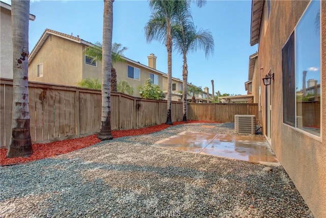 view of yard featuring a patio and cooling unit