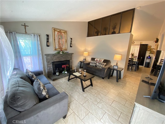 living room featuring a fireplace and vaulted ceiling