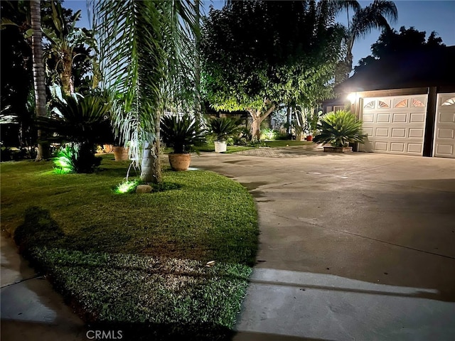 exterior space with a front lawn and a garage