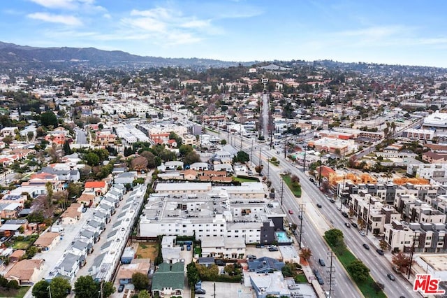 birds eye view of property with a mountain view