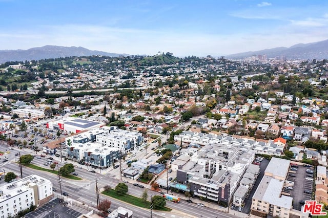 birds eye view of property with a mountain view