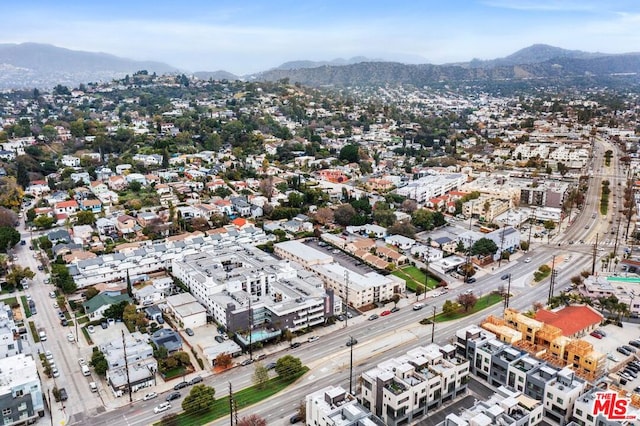 birds eye view of property with a mountain view