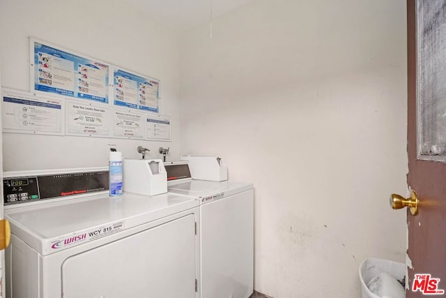 washroom featuring separate washer and dryer