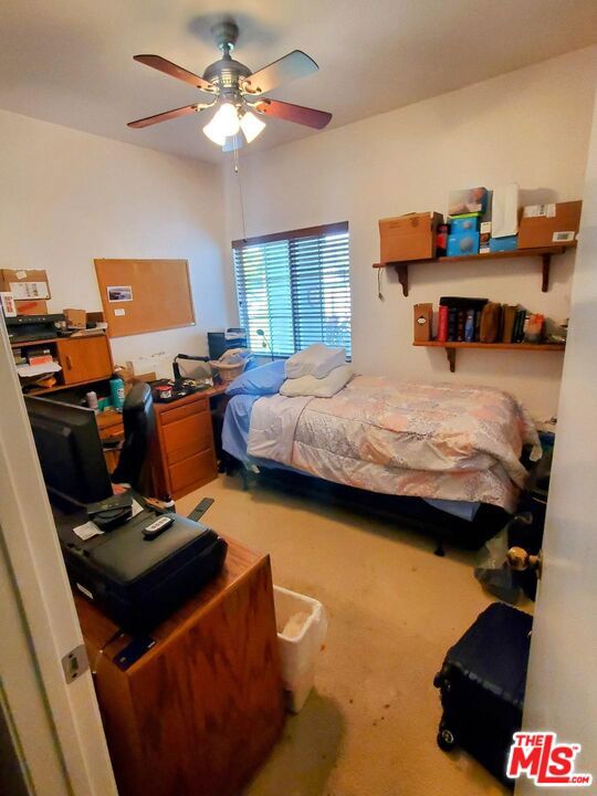 bedroom featuring carpet flooring and ceiling fan