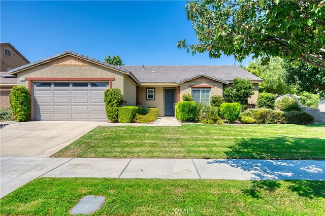 ranch-style house with a garage and a front yard